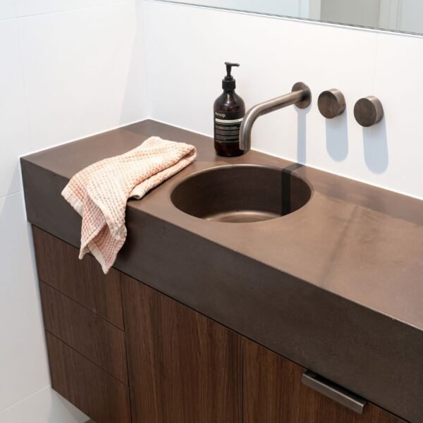 Orbit Concrete Vanity top by Slabs by Design Set in Steel